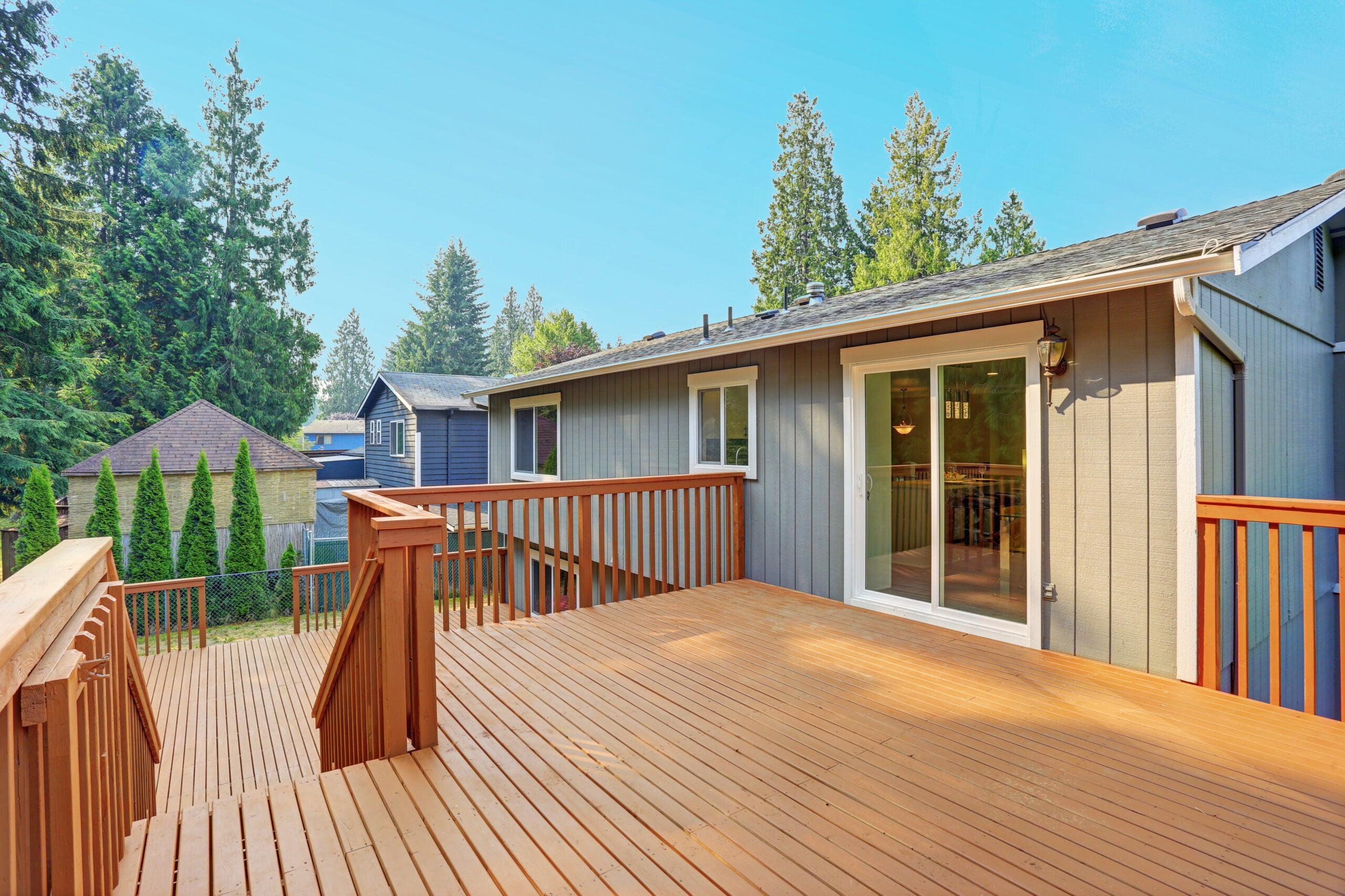 Pre-finished siding installation on a manufactured home exterior