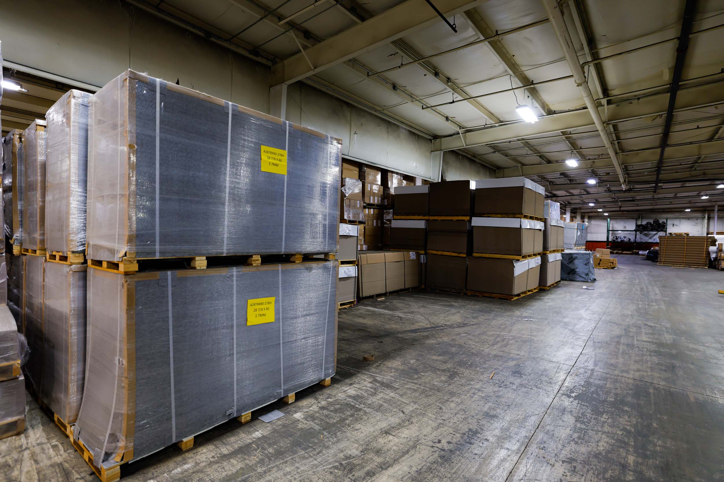 Pallets of wrapped panels and materials in UFP Distribution warehouse
