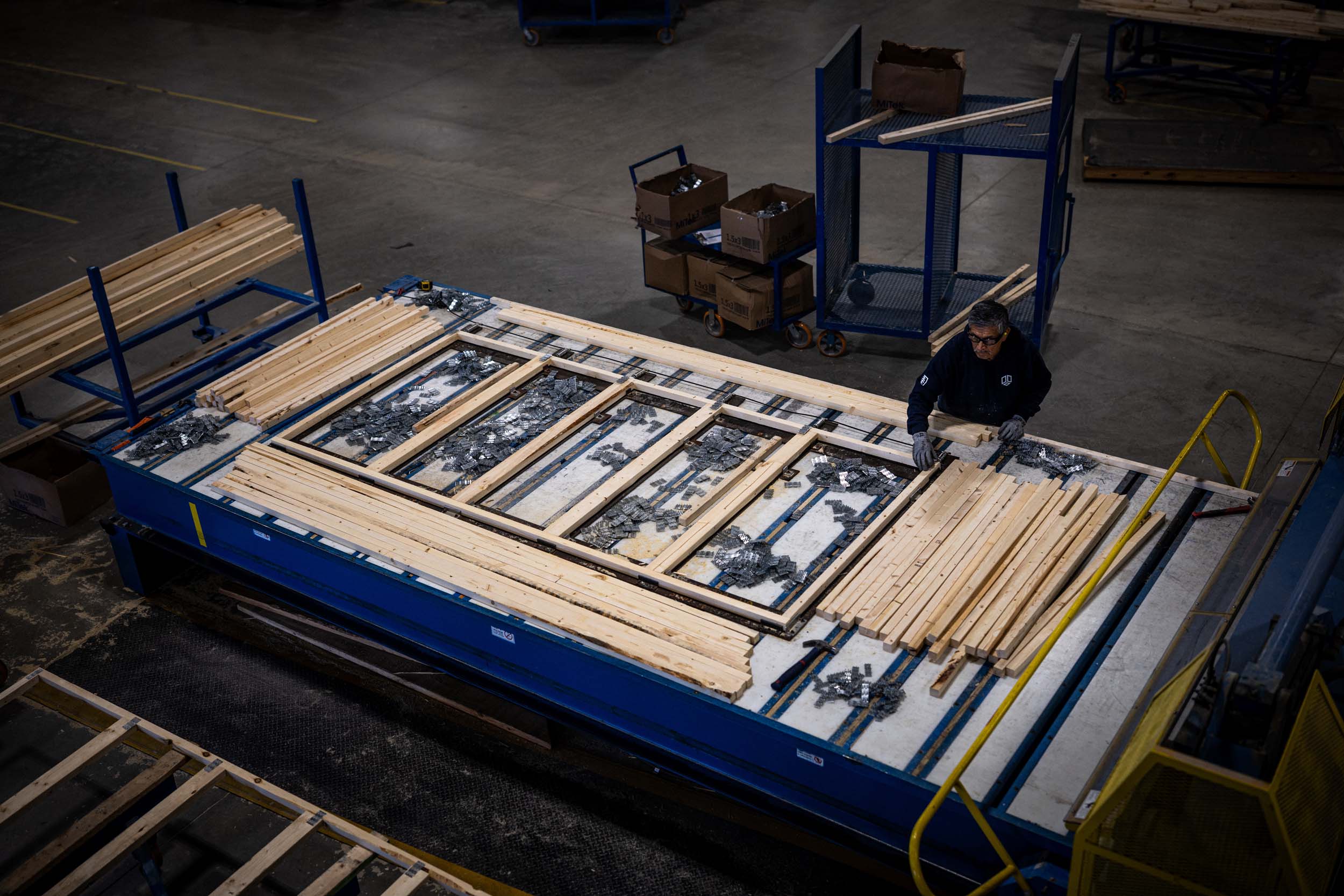 UFP Factory Built team member assembling wall panels on the production floor